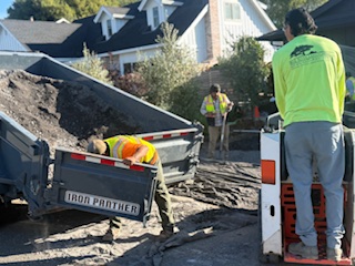 Fresh concrete driveway pour in progress